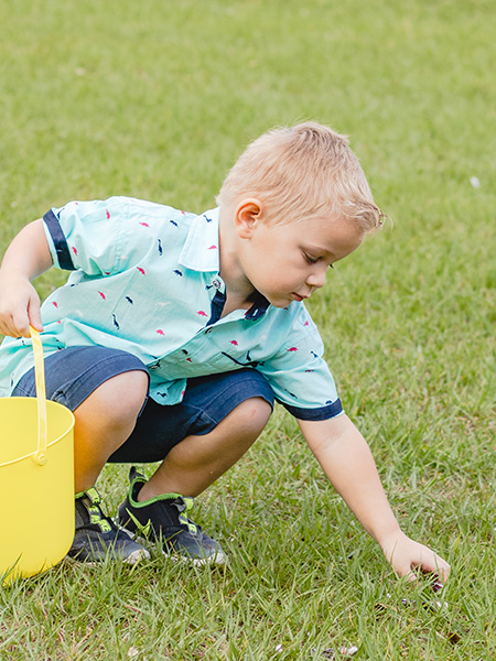 boy finding candy on Easter