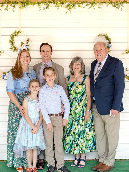 family with photo wall