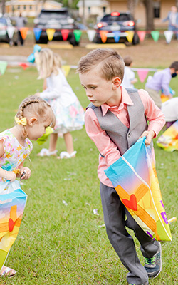 kids gathering candy in bags