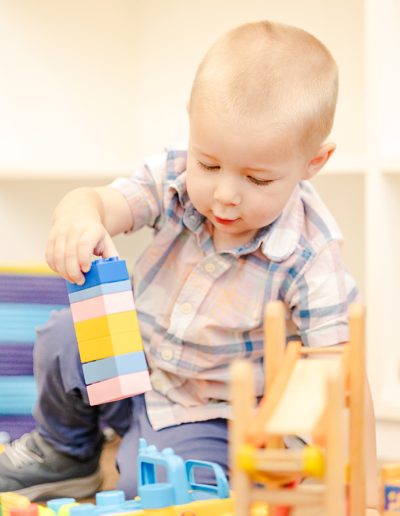 toddler boy playing with blocks